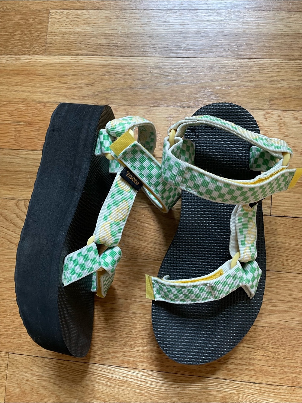 Teva Black flatform Sandal with green checks and lemons.